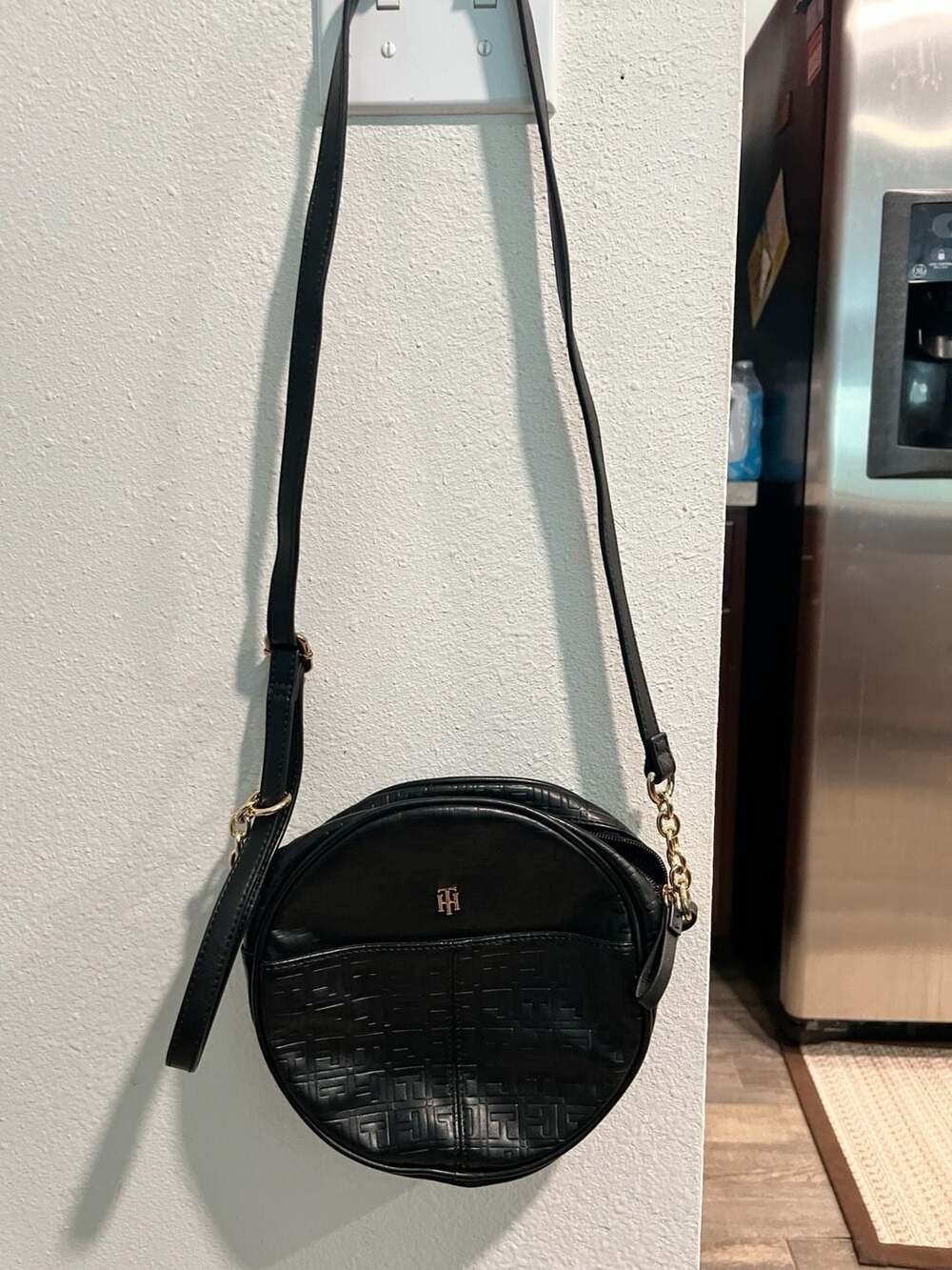 Tommy Hilfiger Monogram Embossed Round Canteen Crossbody Bag